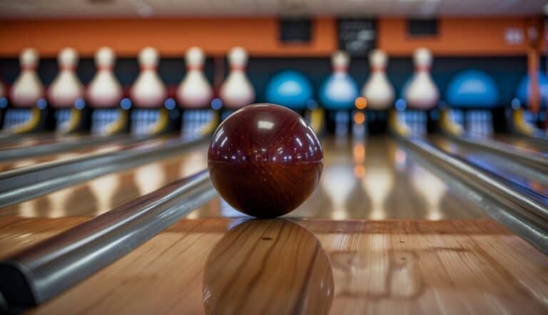 A bowling ball rolls down the polished lane, knocking over the pins in a loud clatter. The player watches eagerly, hoping for a strike